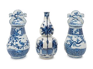 A Pair of Chinese Blue and White Porcelain Wall Vases and a Baluster-Form Vase
Height of vases 15 x width 7 x depth 4 1/2 inches; height of vase 14 1/