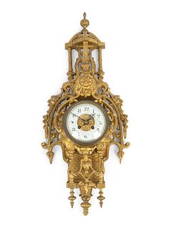 A Regence Style Gilt-Bronze Pendule Murale
Height 22 x width 8 inches.