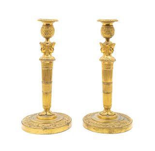 A Pair of Louis XVI Style Gilt-Bronze Candlesticks Mounted as Lamps
Height excluding fittings 12 1/4 inches.