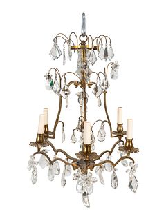 A Louis XV Style Gilt-Metal and Glass Six-Light Chandelier
Height 22 x diameter 16 inches.