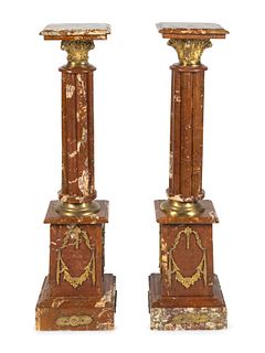 A Pair of Neoclassical Style Gilt-Bronze Mounted Rouge Marble Pedestals
Height 46 1/2 inches.