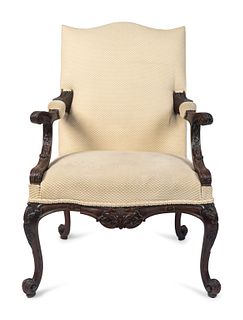 A George III Style Carved Mahogany Library Armchair
Height 43 1/2 x width 30 inches.