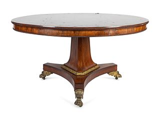 A Regency Bronze-Mounted and Brass-Inlaid Rosewood Center Table
Height 28 1/4 x diameter 52 1/2 inches.