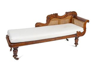 A British Colonial Caned Mahogany Meridienne
Height 31 1/4 x width 77 1/2 x depth 21 1/4 inches.