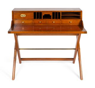 A Brass Mounted Teak Campaign Desk on X-Form Base
Height 36 1/2 x width 42 x depth 24 1/4 inches.