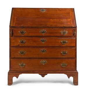 A Chippendale Style Cherrywood Slant-Front Desk
Height 42 1/2 x width 36 3/4 x depth 19 inches.