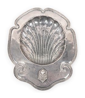 A Spanish Colonial Silver Baptismal Dish
Height 1 1/4 x width 13 x depth 10 inches.
