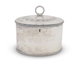 An George III Silver Oval Tea Caddy
Height 4 1/4 x width 5 1/2 inches.