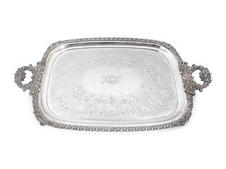 An English Silverplated Two-Handled, Footed Tray
Length over handles 31 x width 19 1/4 inches.