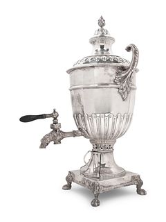 An English Electroplate Tea Urn
Height 24 1/2 x width 14 inches.