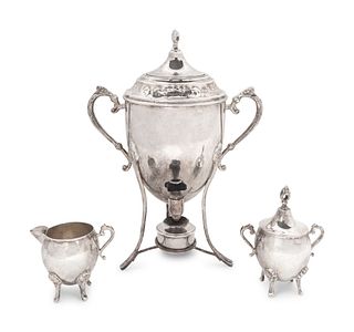 A Silverplate Tea Urn, and Two Pair of Covered Sugar and Creamers
Height of tea urn 14 1/2 x width over handles 11 inches.