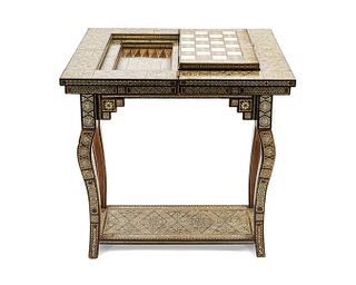 A Moroccan Bone-Inlaid Fruitwood Games Table
Height 28 x length 25 x depth 12 inches.