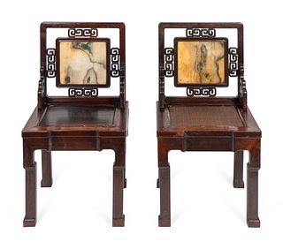 A Near Pair of Chinese Marble-Inset Hardwood Chairs
Height 36 inches.