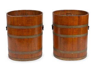A Pair of Chinese  Brass Bound Rice Barrels
Height 28 x width 23 2/34 x depth 18 inches.