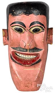 Carved and painted parade mask
