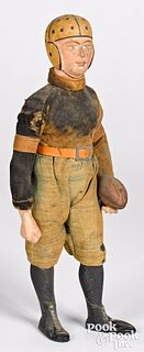 Composition football player doll