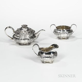 Three-piece George IV Sterling Silver Tea Service, London, 1824-25, Hyam Hyams, maker, with allover chased flowers and rocaille scrolls