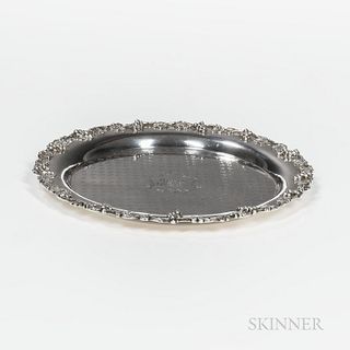 S. Kirk & Son Co. Sterling Silver Charger, Baltimore, early 20th century, with a cast grapevine motif to edge and central monogram, dia