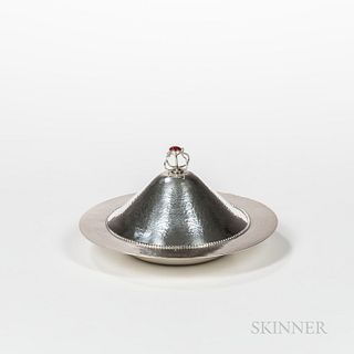 Arts and Crafts Covered Dish, early 20th century, unmarked, with a red cabochon finial, dia. 9 1/2 in.N.B. Similar silver-plated "muffi