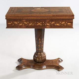 Irish Marquetry Games Table, probably Killarney, mid-19th century, with a depiction of Muckross Abbey to the top, opening to reveal gam
