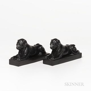 Pair of Wedgwood Black Basalt Lions Couchant, England, late 18th century, each modeled atop a raised rectangular base, impressed upper-
