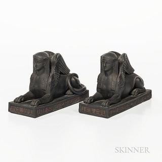 Pair of Wedgwood Egyptian Black Basalt Sphinxes, England, early 19th century, each modeled recumbent and mounted atop rectangular rosso