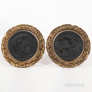 Pair of Wedgwood Black Basalt Roundels, England, early 19th century, each circular plaque molded in relief with depictions of maidens b