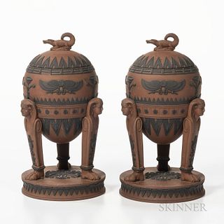 Pair of Wedgwood Egyptian Rosso Antico Tripod Vases and Covers, England, early 19th century, domed covers with crocodile finials, appli