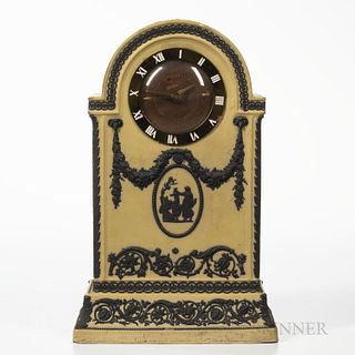 Wedgwood Yellow Jasper Dip Clock Case, England, c. 1930, applied black relief with classical medallion beneath floral festoons terminat