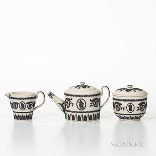 Three-piece Wedgwood Solid White Jasper Tea Set, England, mid-19th century, applied black classical figures and foliate borders in reli