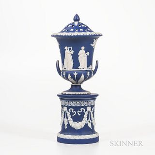 Wedgwood Dark Blue Jasper Dip Vase and Cover on Drum Base, England, 19th century, campana shape with applied white classical figures wi