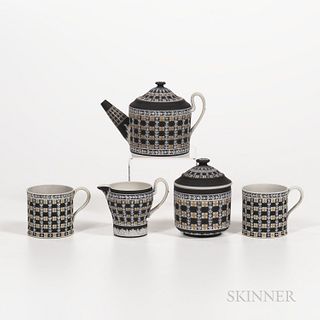 Five Wedgwood Tricolor Diceware Jasper Dip Tea Wares, England, 19th and 20th century, each with white relief to a black ground and yell