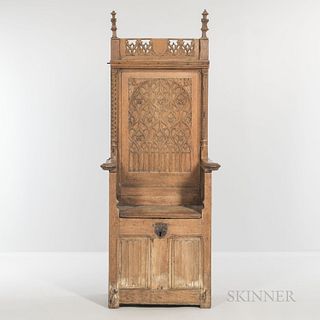Gothic-style Carved Oak Armchair, late 19th/early 20th century, with carved tracery panels and a hinged seat, ht. 75, wd. 30, dp. 18 1/
