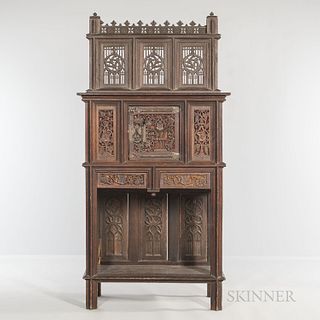 Gothic-style Carved Oak Cabinet, late 19th/early 20th century, with an upper tracery back gallery and a single cabinet door above two d