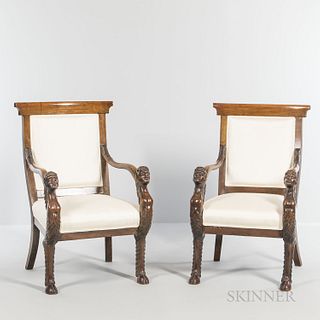 Pair of Italian Walnut Armchairs, each hand rest carved with the head of Bacchus terminating in hoof foot, ht. 39 1/2, wd. 24 1/2, dp.