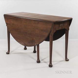 George III Walnut Drop-leaf Table, on turned legs terminating in a pad foot, ht. 28 1/2, wd. 49, dp. 18 1/2 (closed).