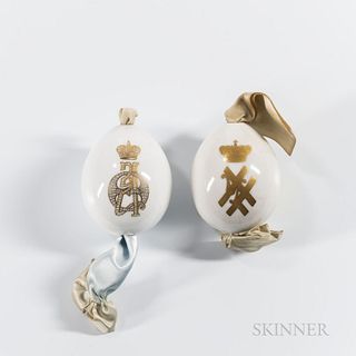 Two Russian Porcelain Easter Eggs, c. 1900, Imperial Porcelain Manufactory, each with a plain white body, one bearing the gilt cipher o