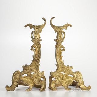 Pair of Gilt-bronze Rococo-style Chenet, France, 19th century, floral spray to a scrolled foliate body, ht. 19 in.