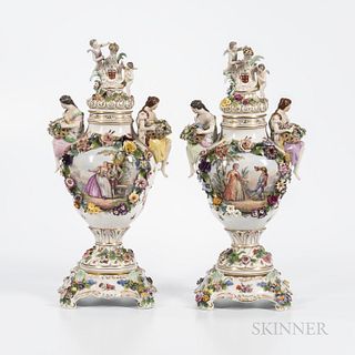 Pair of German Porcelain Vases, Covers, and Stands, early 20th century, likely Wurttemberg, gilt trim with polychrome enamels, the cove