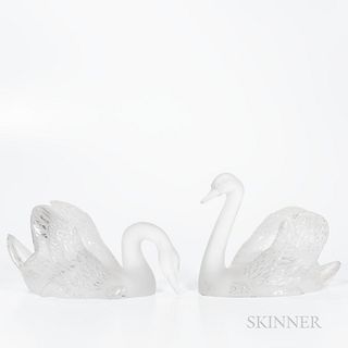 Pair of Lalique Swans, France, 20th century, frosted bodies, one with head raised, ht. 9 1/2, one with head lowered, ht. 6 7/8 in., etc