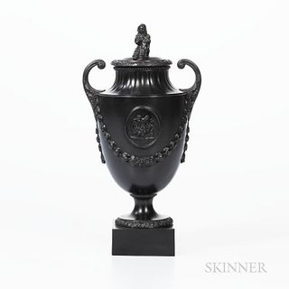 Wedgwood & Bentley Black Basalt Urn and Cover, England, c. 1780, Sybil finial and scrolled handles, raised classical medallion above la