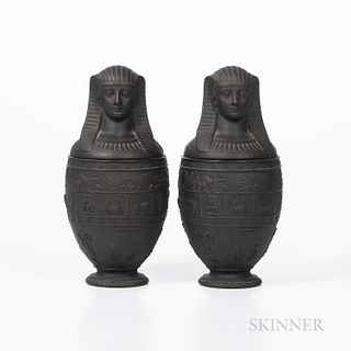 Pair of Wedgwood Black Basalt Canopic Jars and Covers, England, c. 1867, with bands of hieroglyphs and zodiac signs above Egyptian moti