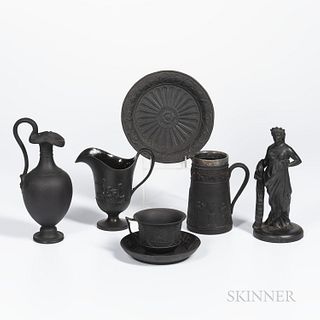 Six Wedgwood Black Basalt Items, England, 19th century, a standing figure of Columbia, ht. 8; helmet jug, ht. 5 34; oenochoe ewer, ht.