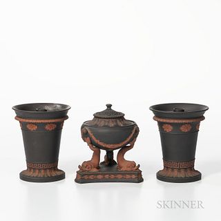 Three Wedgwood Black Basalt Items, England, 19th century, each with applied rosso antico in relief, a dolphin incense burner with cover