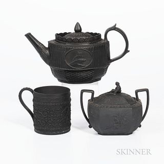 Three Wedgwood Black Basalt Items, England, 19th century, cylindrical mug with wide oak leaf band, ht. 4 1/8; octagonal shaped sugar bo