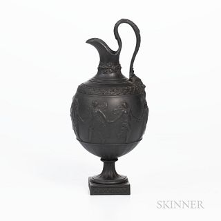 Wedgwood Black Basalt Ewer, England, early 19th century, bulbous shape with scrolled foliate molded handle terminating at a Bacchus mas