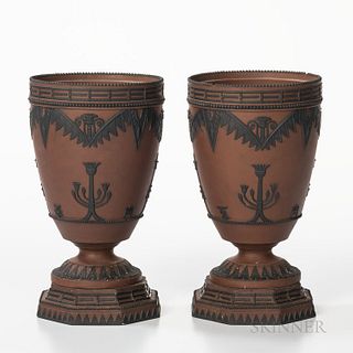 Pair of Wedgwood Rosso Antico Egyptian Vases, England, early 19th century, each with applied black basalt motifs and set on an octagona