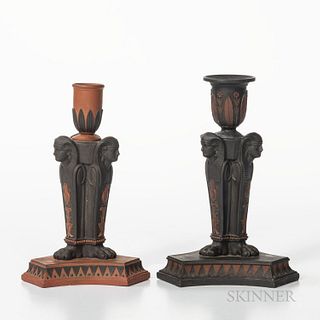 Two Similar Wedgwood Egyptian Candlesticks, England, early 19th century, a rosso antico with black basalt relief and a black basalt wit