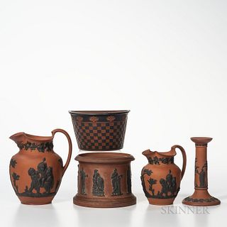 Six Rosso Antico Items, England, 19th century, each with black basalt relief, five marked Wedgwood, an oval boat form with Greek head a