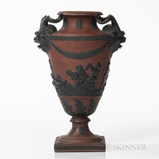 Rosso Antico Vase, England, early 19th century, possibly Spode, applied black basalt relief including goat mask and horn handles, laure